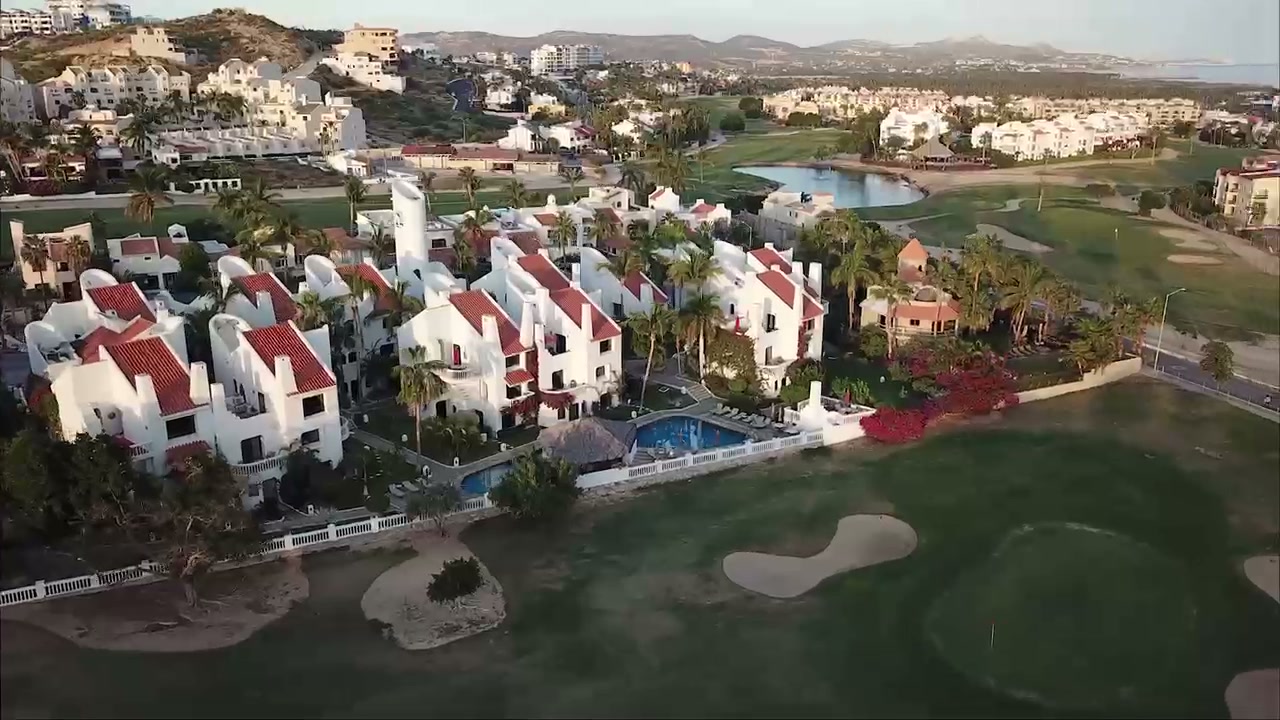 Aerial view of Villas Baja, pool, and surrounding golf course